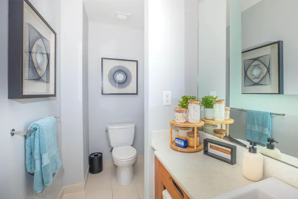 a bathroom with a toilet a sink and a shower