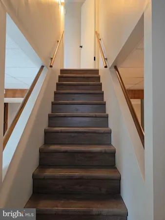 a room with pool table and chandelier