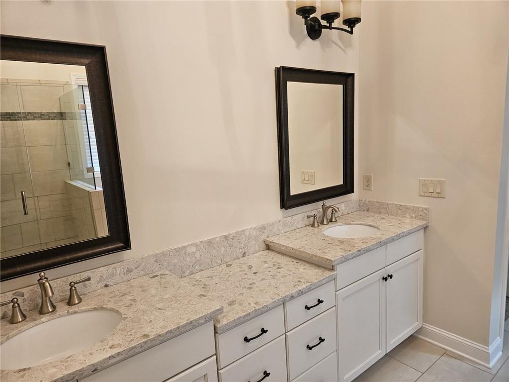 3920 Glenview Club Lane Duluth, GA 30097 - Photo 27 of 44 a bathroom with a granite countertop sink vanity and mirror