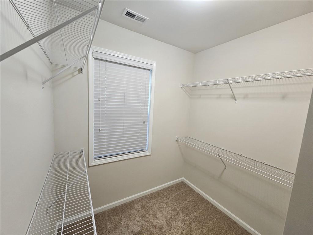 3920 Glenview Club Lane Duluth, GA 30097 - Photo 33 of 44 a view of a room with racks on the wall