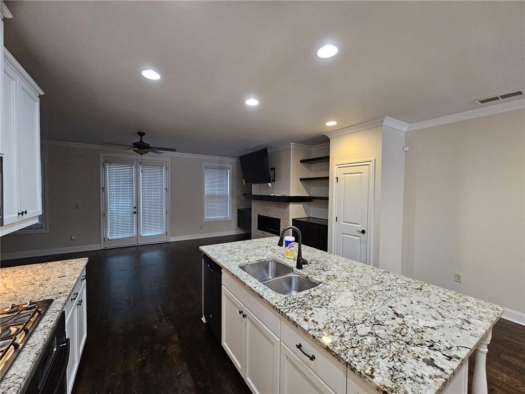 3920 Glenview Club Lane Duluth, GA 30097 - Photo 10 of 44 a kitchen with a sink appliances and cabinets