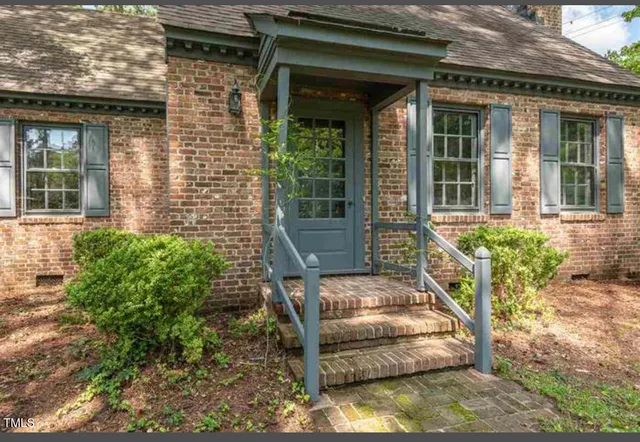 front view of a house with a small yard