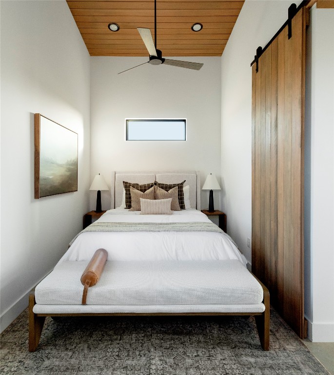 9361 Highway 290, Unit 118 Hye, TX 78635 - Photo 24 of 38 a bedroom with a bed and wooden floor