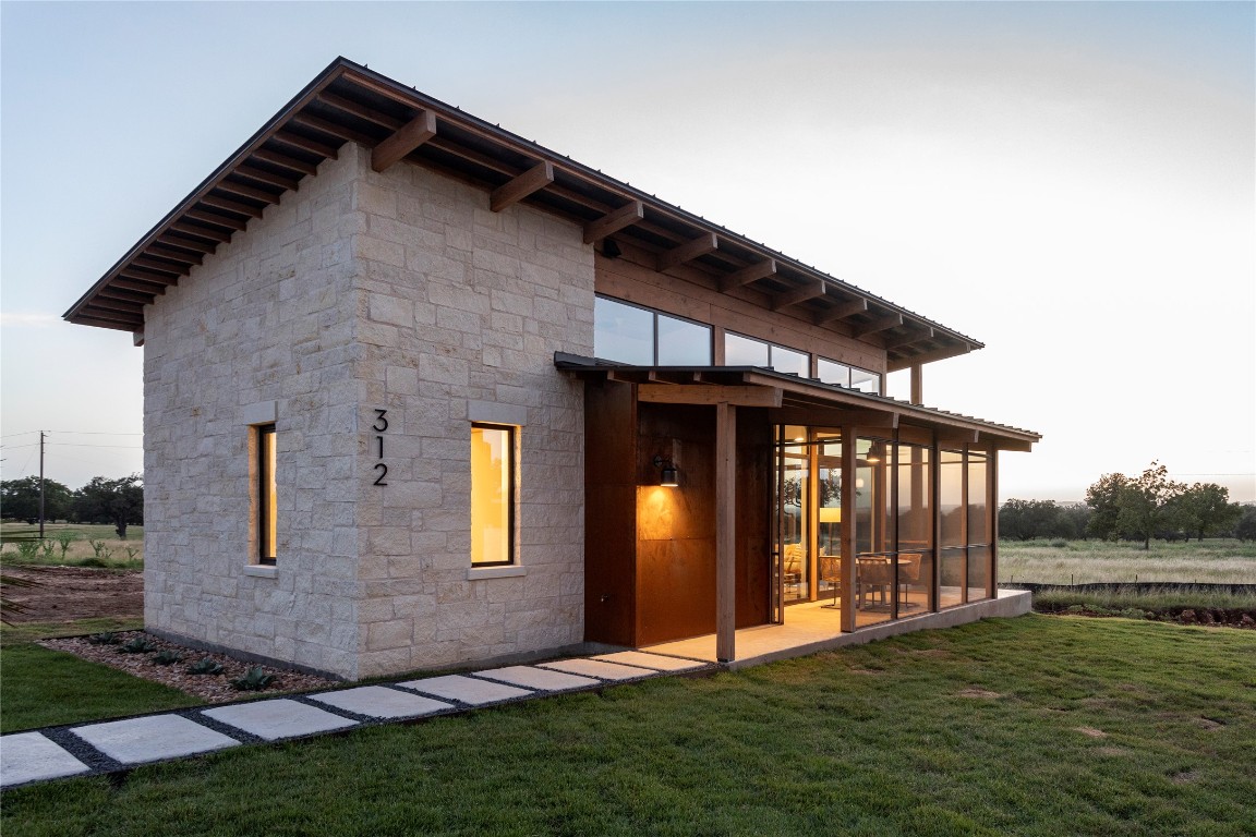 9361 Highway 290, Unit 118 Hye, TX 78635 - Photo 31 of 38 a front view of a house with garden