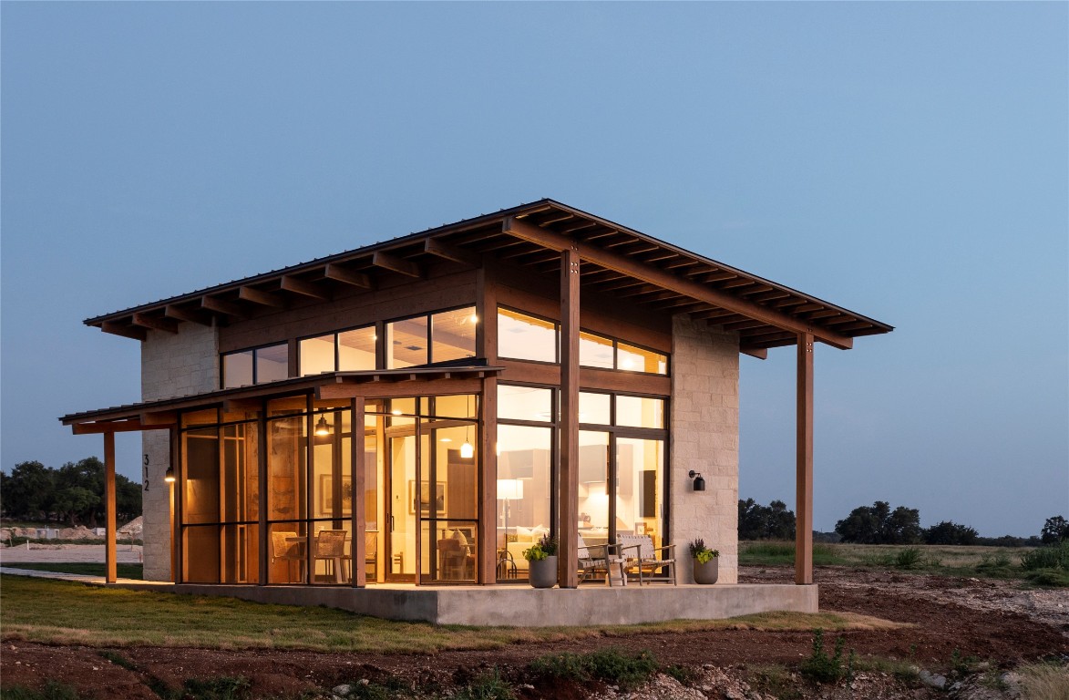9361 Highway 290, Unit 118 Hye, TX 78635 - Photo 34 of 38 a front view of a house with a yard