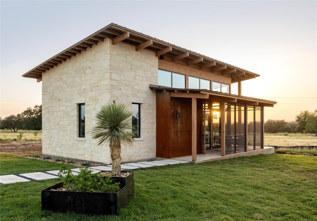 9361 Highway 290, Unit 118 Hye, TX 78635 - Photo 17 of 38 a front view of a house with garden