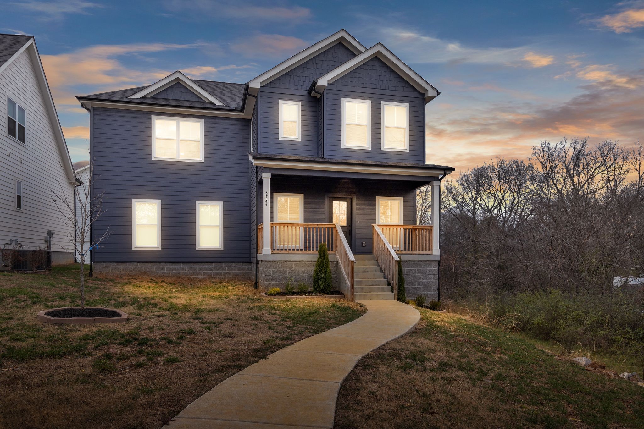 a front view of a house with a yard