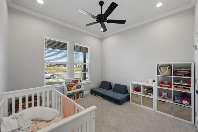 a living room with furniture and a book shelf
