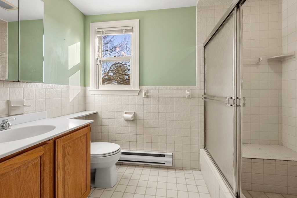 1140 Webster Street Needham, MA 02492 - Photo 17 of 27 a bathroom with a sink a toilet and shower