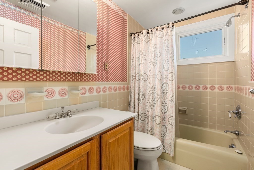 1140 Webster Street Needham, MA 02492 - Photo 20 of 27 a bathroom with a sink and a mirror