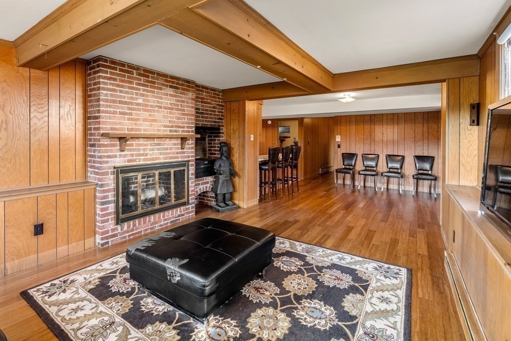 1140 Webster Street Needham, MA 02492 - Photo 21 of 27 a living room with furniture and a wooden floor