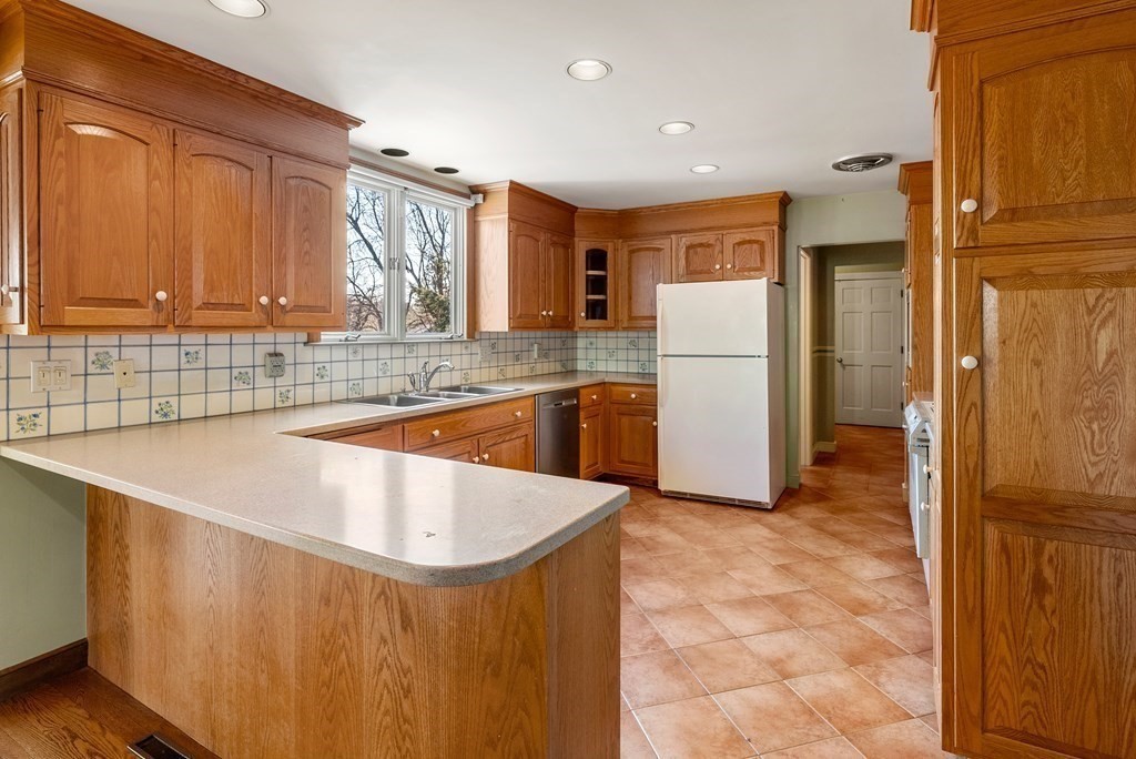 1140 Webster Street Needham, MA 02492 - Photo 7 of 27 a view of kitchen with refrigerator and cabinets