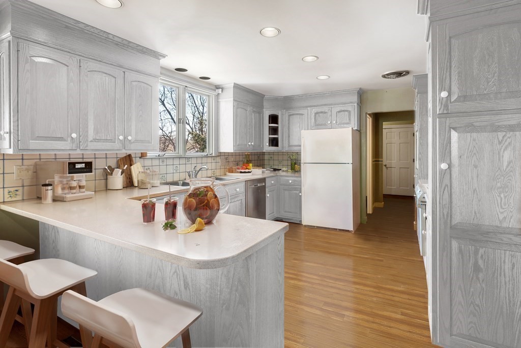 1140 Webster Street Needham, MA 02492 - Photo 8 of 27 a kitchen with a sink a stove a refrigerator and cabinets
