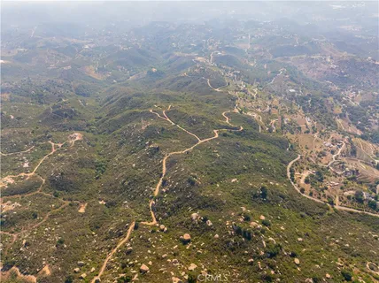 an aerial view of residential house and green space