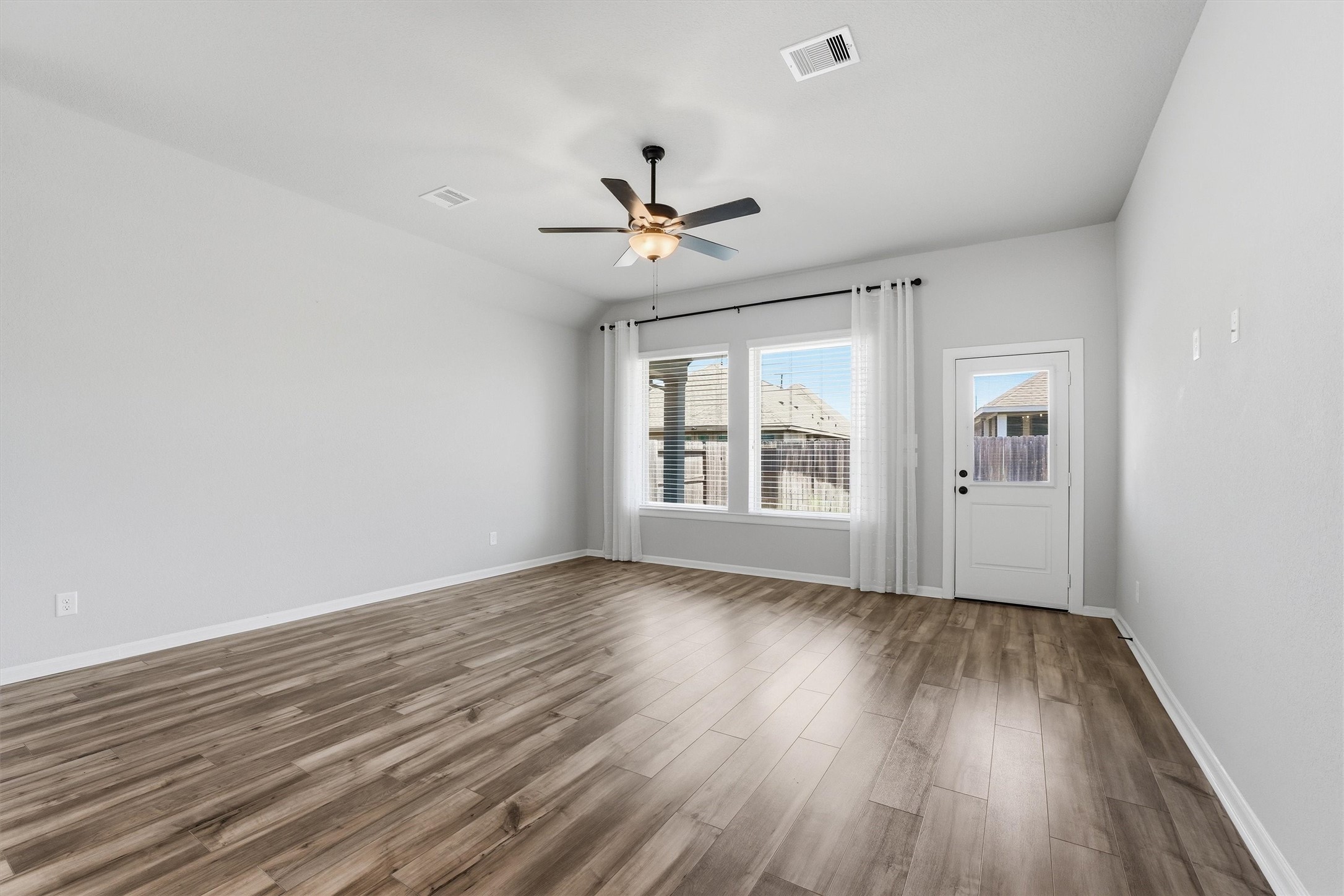 1338 Lakeside Crk Road Magnolia, TX 77354 - Photo 15 of 37 wooden floor in an empty room with a window