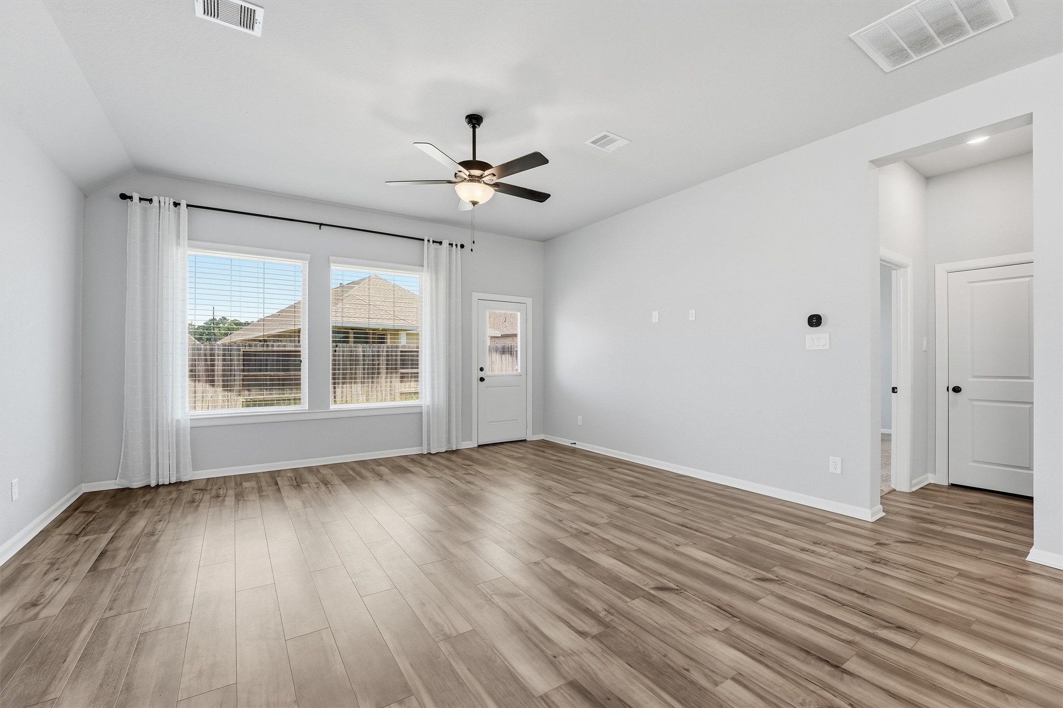 1338 Lakeside Crk Road Magnolia, TX 77354 - Photo 16 of 37 wooden floor in an empty room with a window