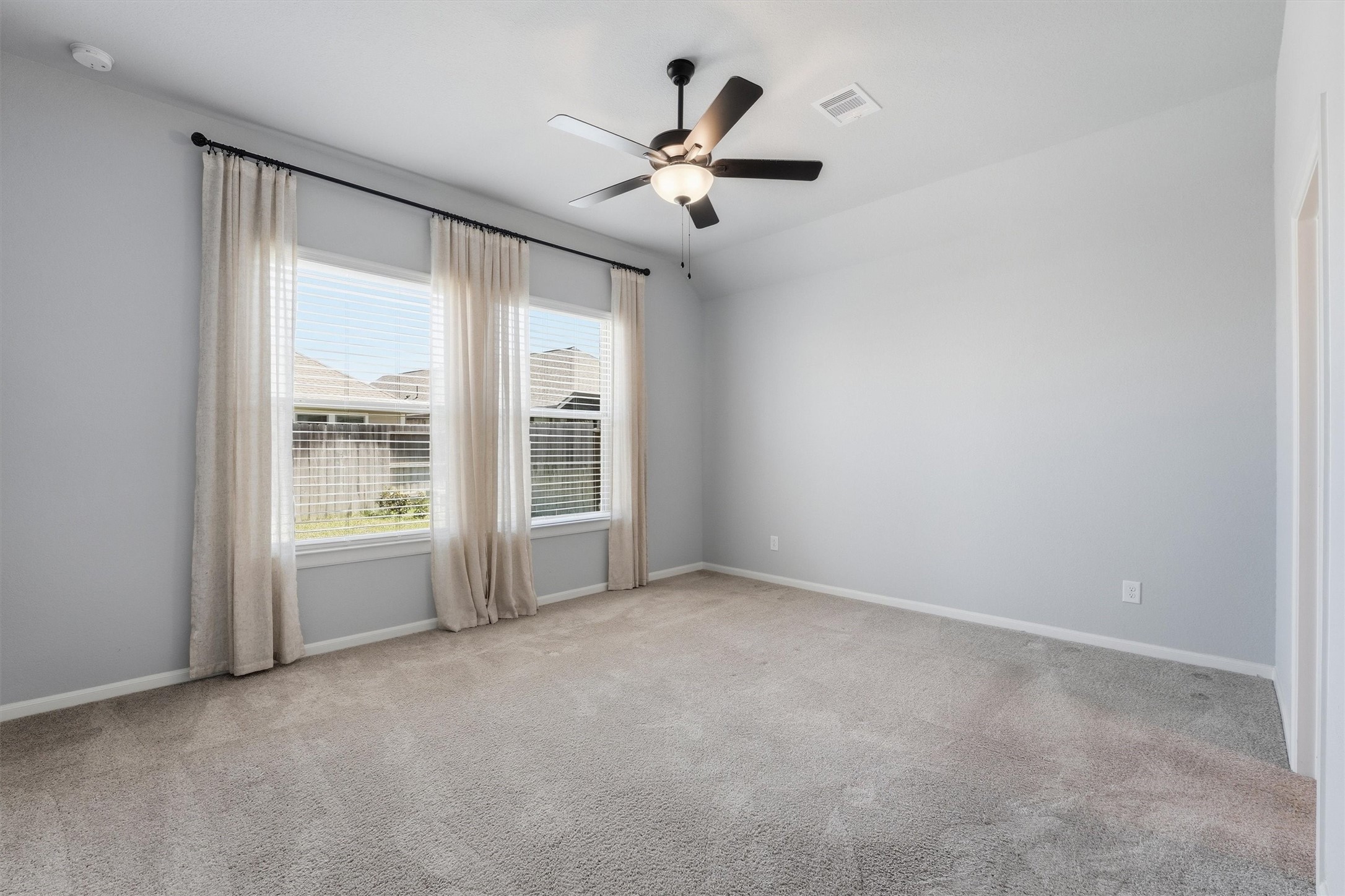 1338 Lakeside Crk Road Magnolia, TX 77354 - Photo 20 of 37 an empty room with ceiling fan and window