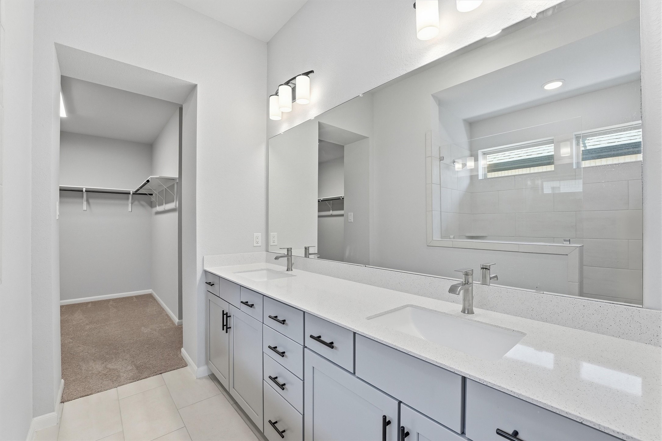 1338 Lakeside Crk Road Magnolia, TX 77354 - Photo 22 of 37 a bathroom with double sink and a mirror