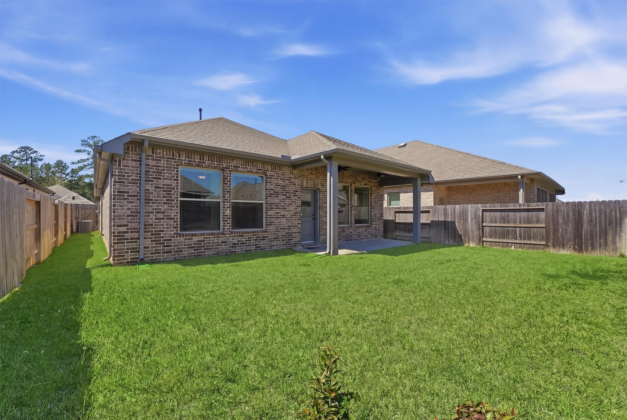 1338 Lakeside Crk Road Magnolia, TX 77354 - Photo 29 of 37 a front view of a house with a garden