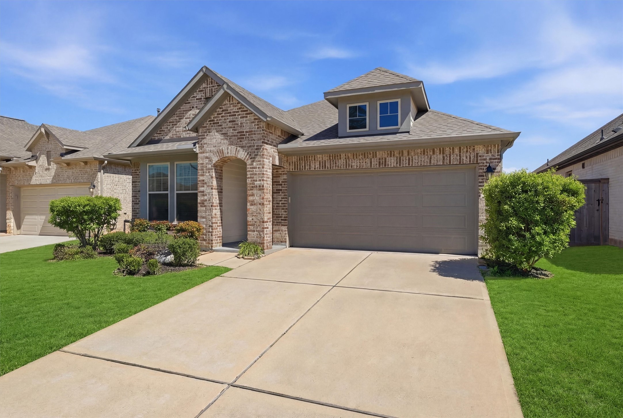 1338 Lakeside Crk Road Magnolia, TX 77354 - Photo 3 of 37 a front view of a house with garden
