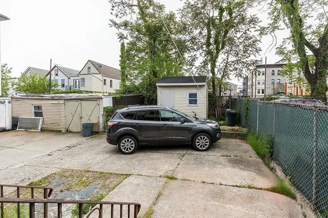 a car parked in front of a house