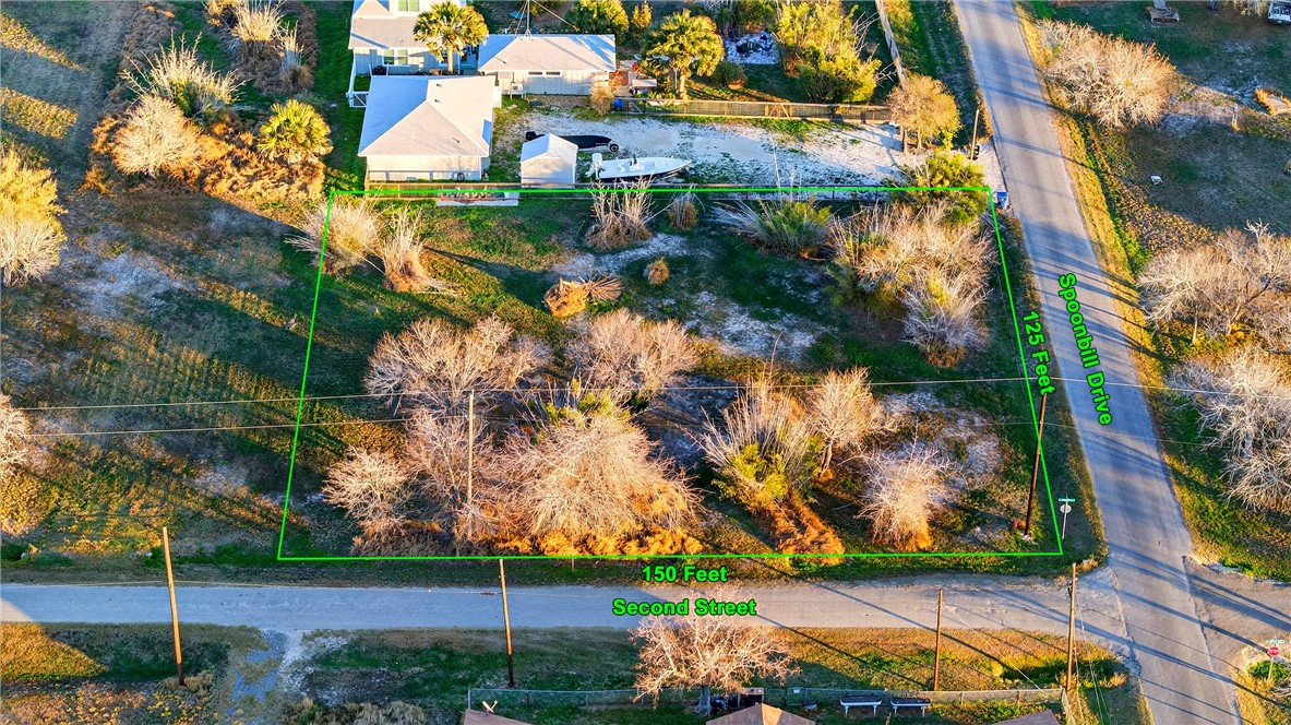 402 2nd Street Bayside, TX 78340 - Photo 3 of 9 an aerial view of residential houses with outdoor space