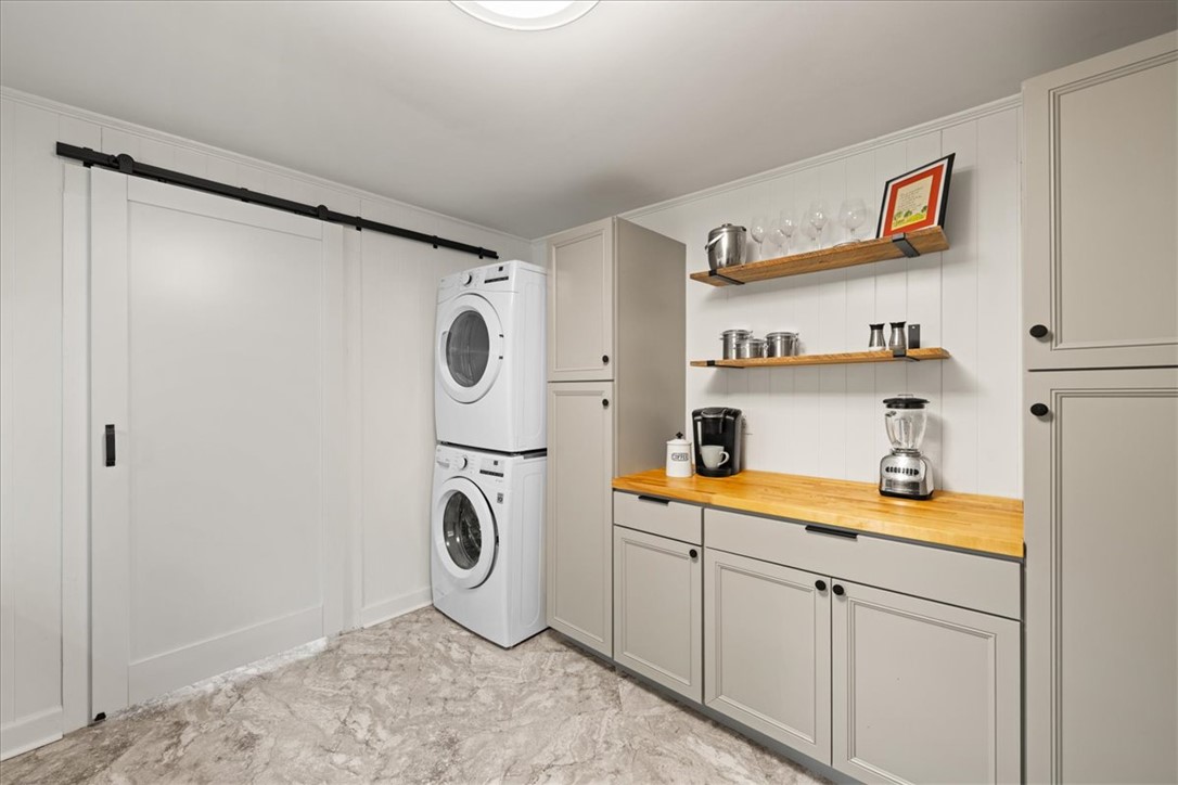 174 Holliday Road Six Mile, SC 29682 - Photo 19 of 49 Functional laundry and utility area featuring stacked appliances and clean and efficient storage