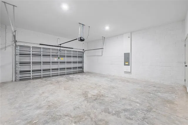 a view of an empty room with a ceiling fan