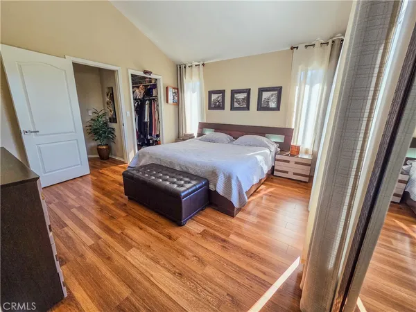 a view of walk in closet with clothes