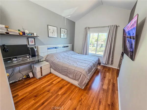 a bedroom with a bed and a walk in closet