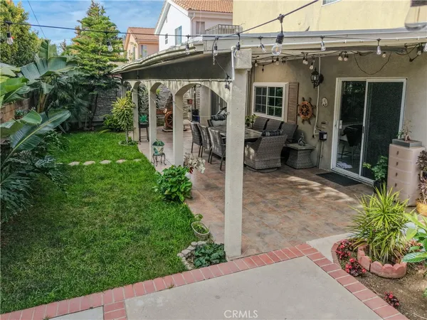 a view of a patio with a table and chairs