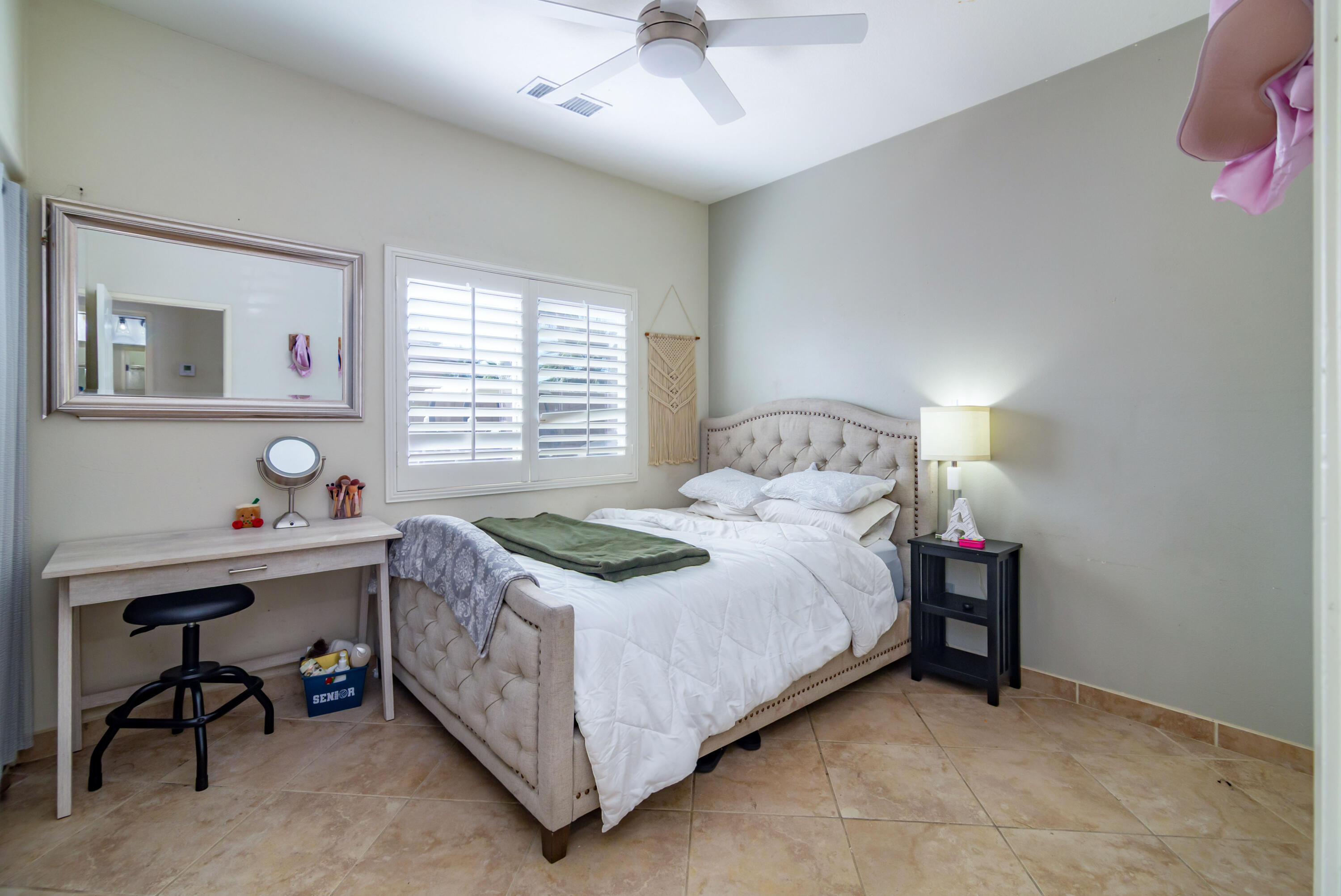 40681 Morris Street Indio, CA 92203 - Photo 32 of 36 a bedroom with a bed and a table