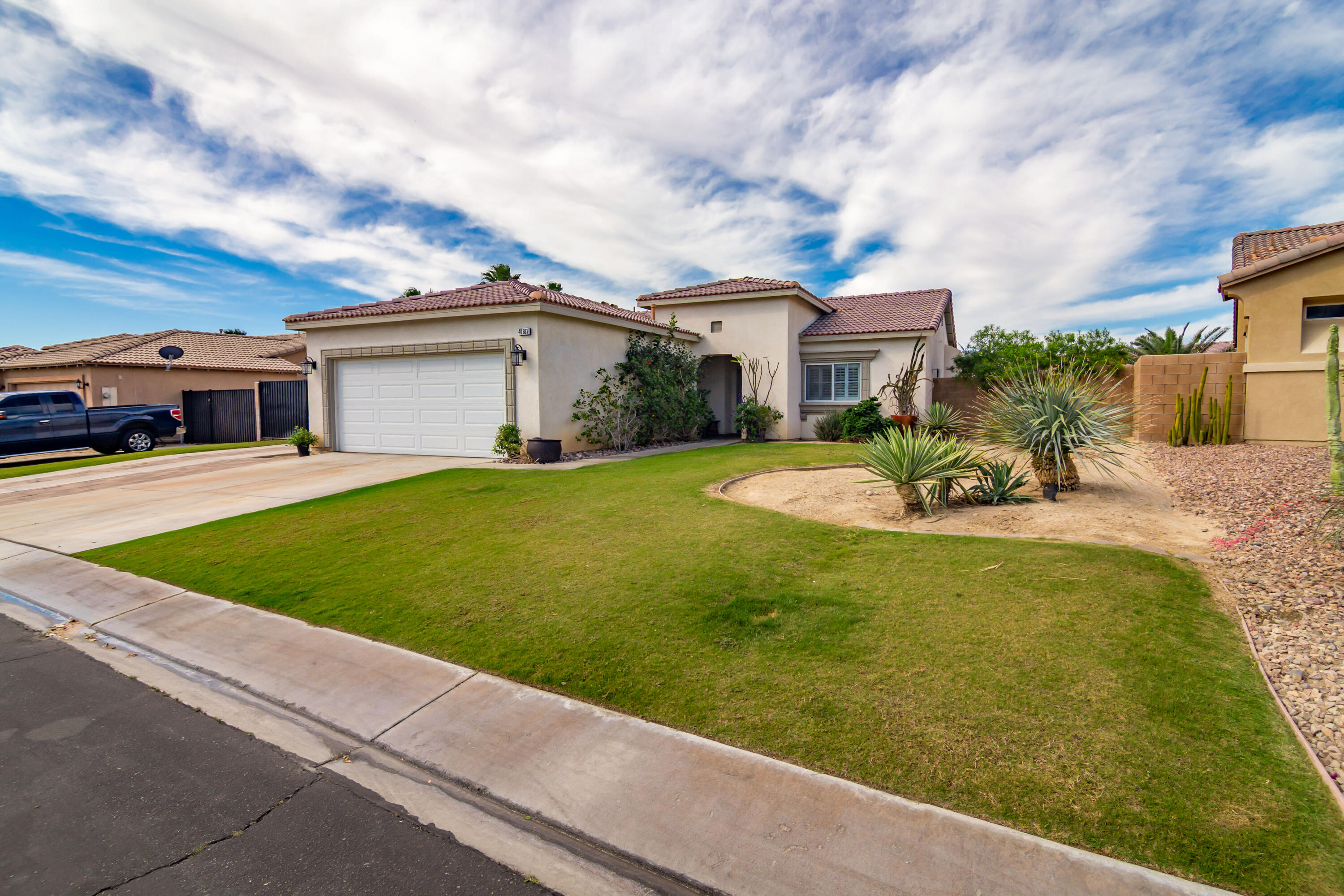 40681 Morris Street Indio, CA 92203 - Photo 4 of 36 a view of a house with a yard porch and sitting area