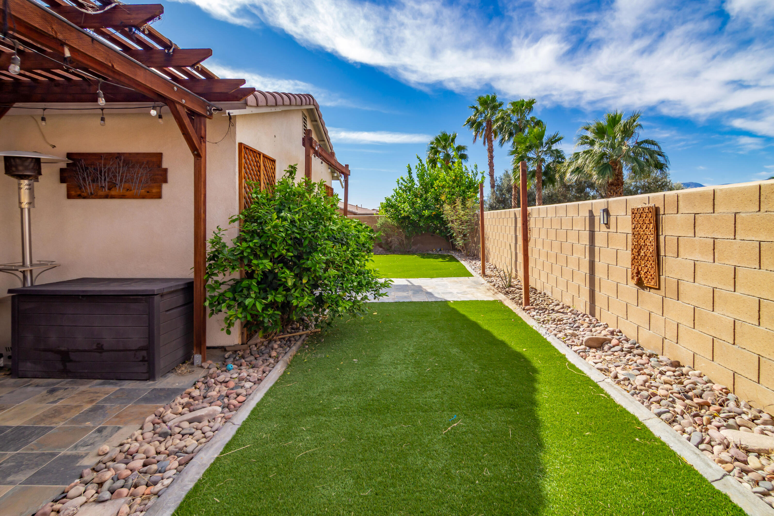 40681 Morris Street Indio, CA 92203 - Photo 8 of 36 a view of a house with a yard and flower garden