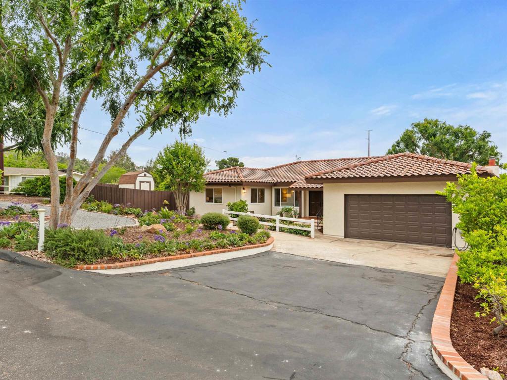 13737 Temple Street Poway, CA 92064 - Photo 3 of 38 a front view of a house with a yard and potted plants