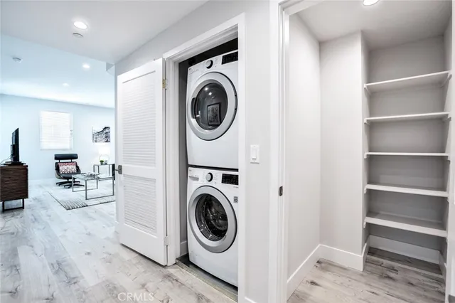 a view of a hallway with washer and dryer