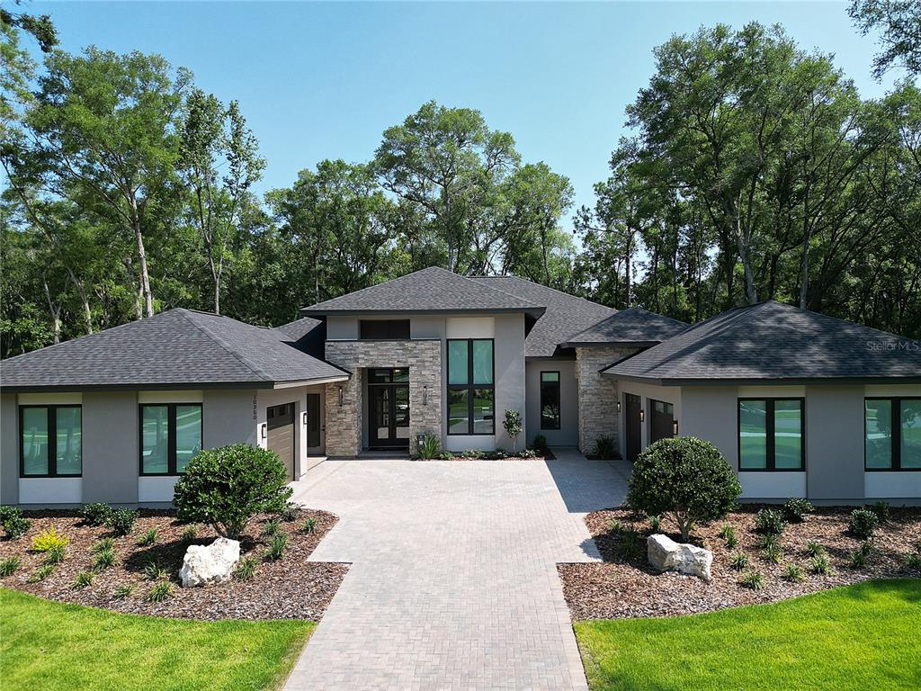 3120 Southwest 108 Way Gainesville, FL 32608 - Photo 1 of 29 a front view of a house with a yard