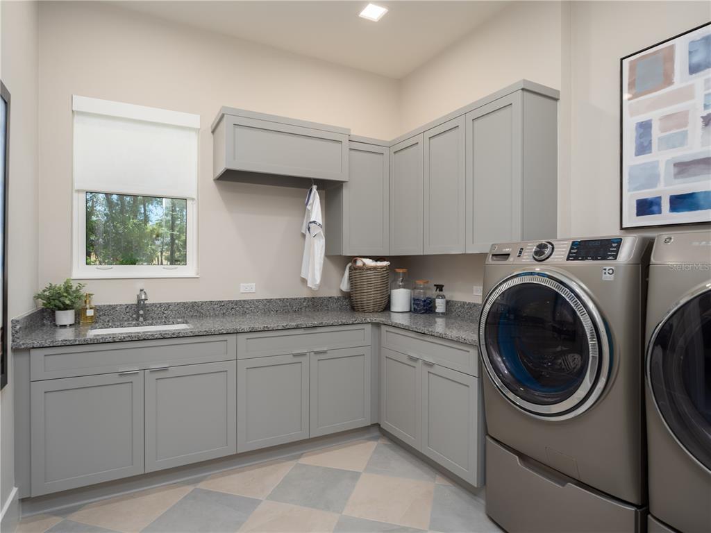 3120 Southwest 108 Way Gainesville, FL 32608 - Photo 16 of 29 a utility room with sink dryer and washer