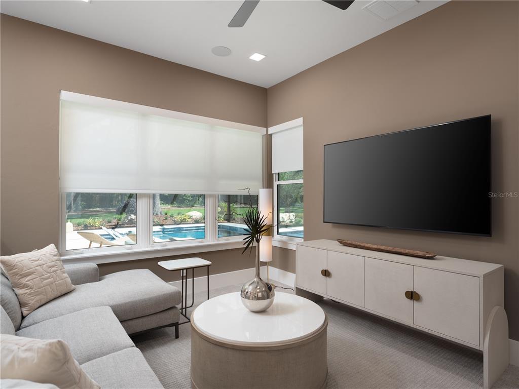 3120 Southwest 108 Way Gainesville, FL 32608 - Photo 17 of 29 a living room with furniture and a flat screen tv