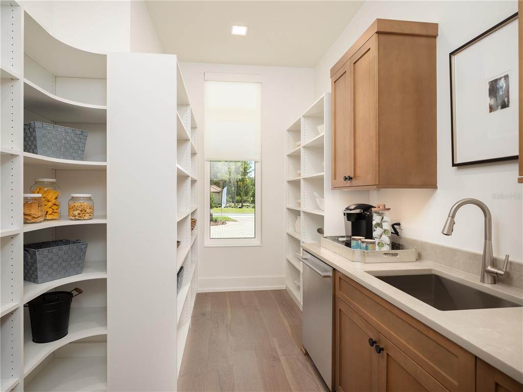 3120 Southwest 108 Way Gainesville, FL 32608 - Photo 10 of 29 a kitchen with a sink cabinets and window