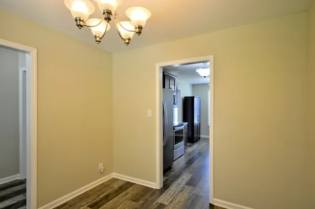 a view of a hallway with a chandelier