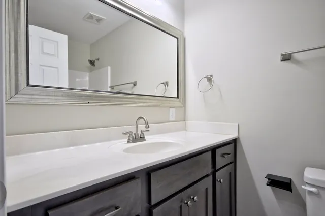 a bathroom with a glass shower door