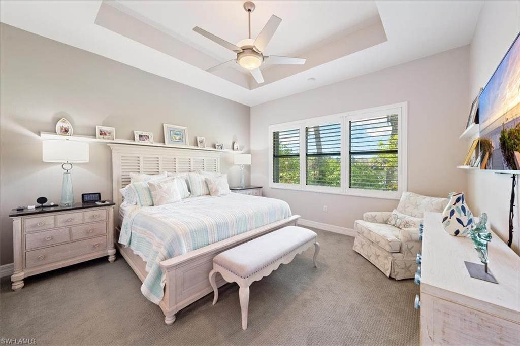 13479 Sumter Lane Naples, FL 34109 - Photo 13 of 35 a spacious bedroom with a bed and a large window