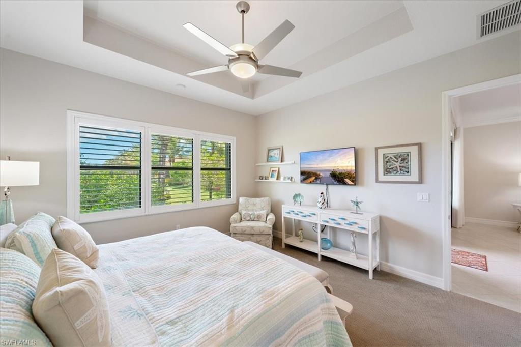 13479 Sumter Lane Naples, FL 34109 - Photo 15 of 35 a bedroom with a bed and a large window