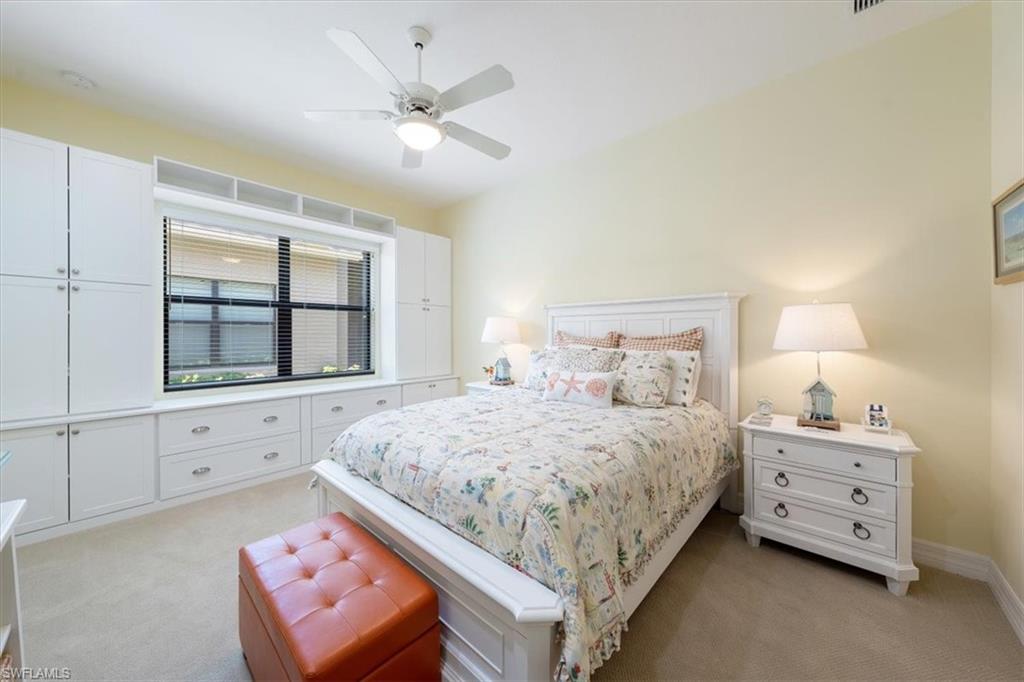 13479 Sumter Lane Naples, FL 34109 - Photo 18 of 35 a bedroom with a bed and a window