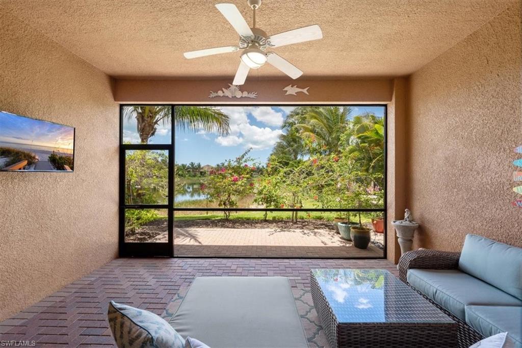 13479 Sumter Lane Naples, FL 34109 - Photo 2 of 35 a living room with couch and a large window