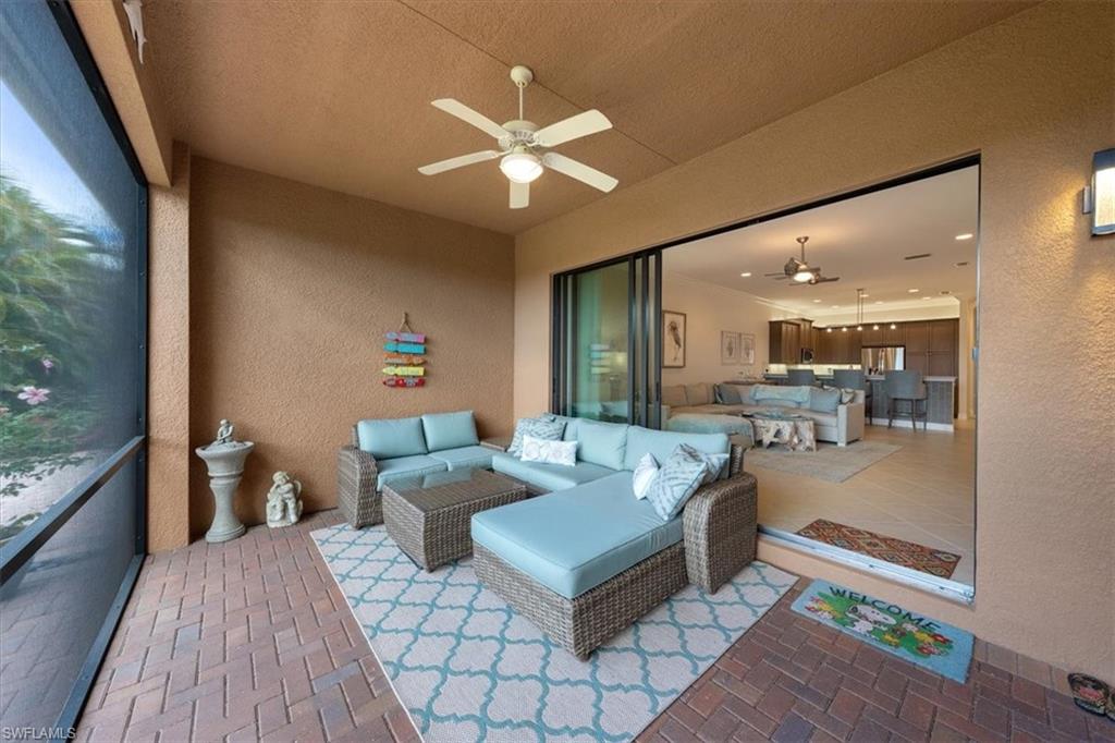 13479 Sumter Lane Naples, FL 34109 - Photo 24 of 35 a living room with furniture and a large window