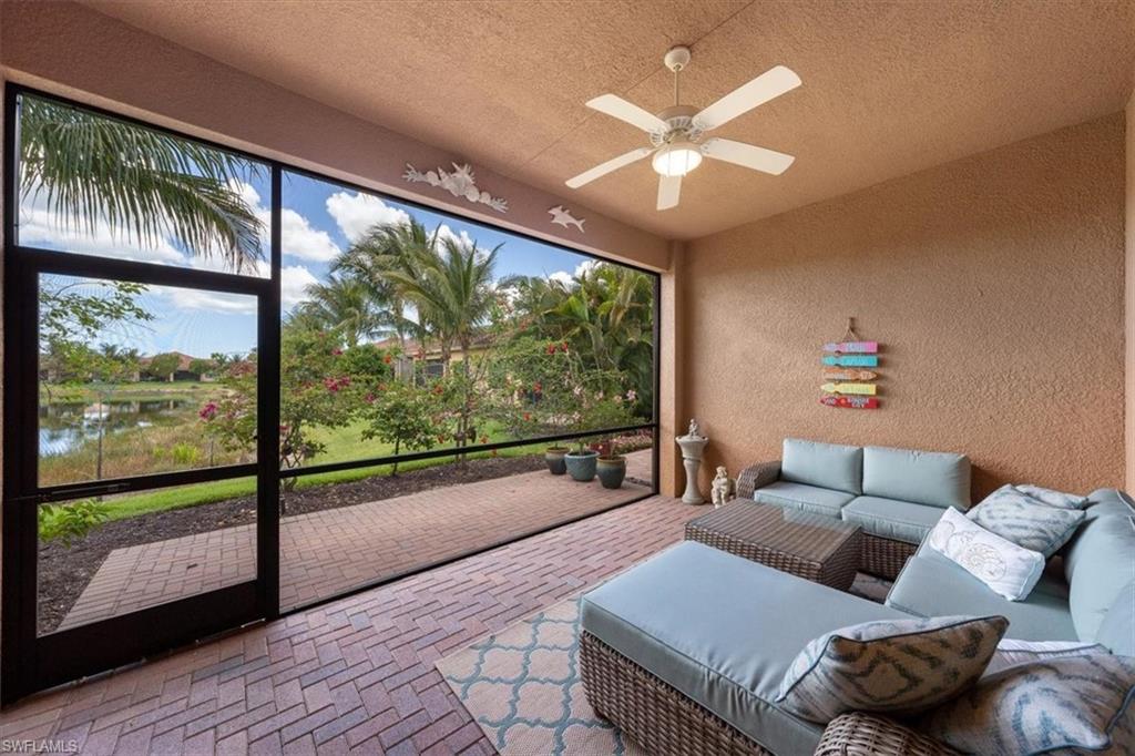 13479 Sumter Lane Naples, FL 34109 - Photo 25 of 35 a living room with furniture and a large window