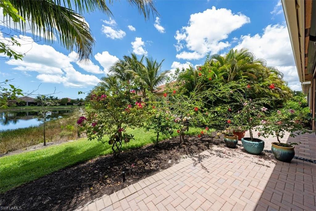 13479 Sumter Lane Naples, FL 34109 - Photo 28 of 35 a view of a backyard with plants and lake view