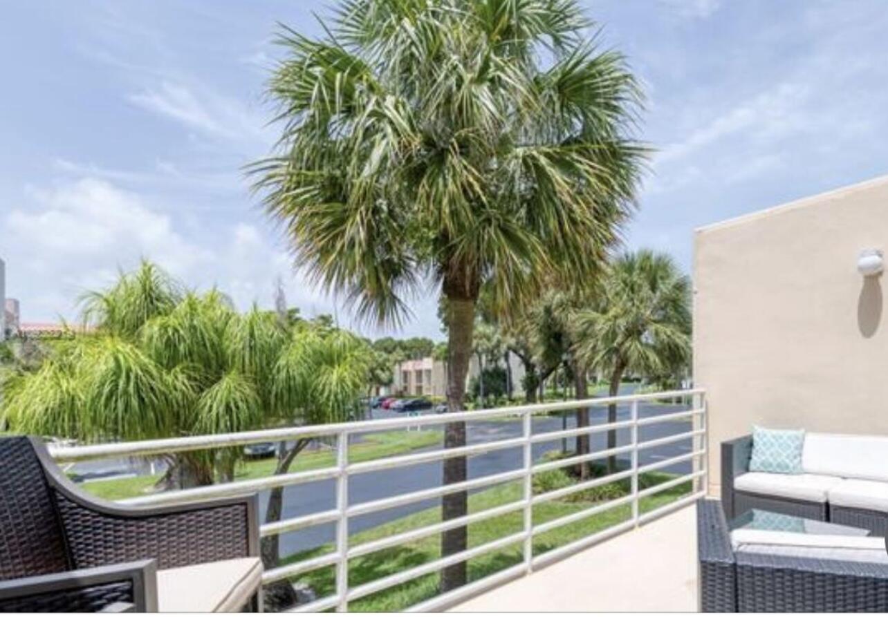 1605 Highway 1, Unit M2202 Jupiter, FL 33477 - Photo 15 of 19 a view of a chair and tables in the balcony